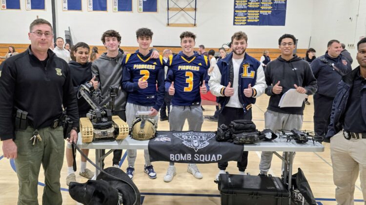 Lynnfield Students pose with Massachusetts State Police Bomb Squad at LHS Career Fair
