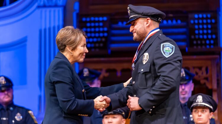 Governor Healey shakes hands with Medal of Valor recipient Gianfranco M. Pisano